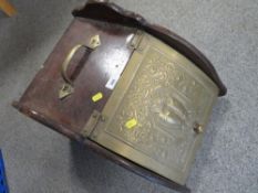 A brass fronted coal box