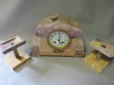 An Art Deco style marble garniture mantle clock