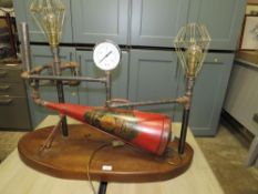 An unusual industrial style lamp with fire extinguisher and gauge detail