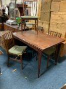 A mid-century teak extending dining table and four chairs A/F - possibly ‘A Younger & Ltd’