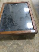 A small glazed display case