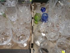 Two trays of assorted cut glass to include decanters etc