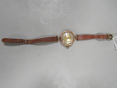 A hallmarked 9 carat gold ladies wrist watch on leather strap