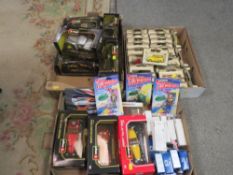 Three trays of assorted vintage toys to include boxed Burago examples, three carded Matchbox
