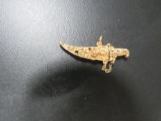 A hallmarked 9 carat gold novelty dagger and sheath set with semi precious stones approx weight 3.4g