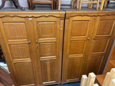 A pair of modern heavy oak two door wardrobes / bookcases