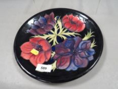 A Moorcroft plate marked as a second