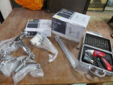 A tray of boxed and loose taps and a cordless screwdriver