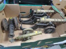 A pair of desk cannons together with two others