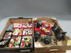 Two trays of vintage fishing tackles to include many flies, fishing reels etc