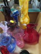 A tray of assorted coloured glass to include Caithness style examples