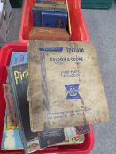 Two trays of assorted vintage books to include Triumph Herald, saloon and coupe spare parts