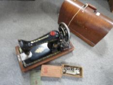 A vintage cased Singer sewing machine