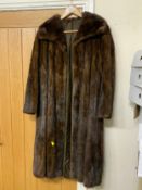A vintage rich mahogany brown mink fur three-quarter length coat, fully lined with embroidered