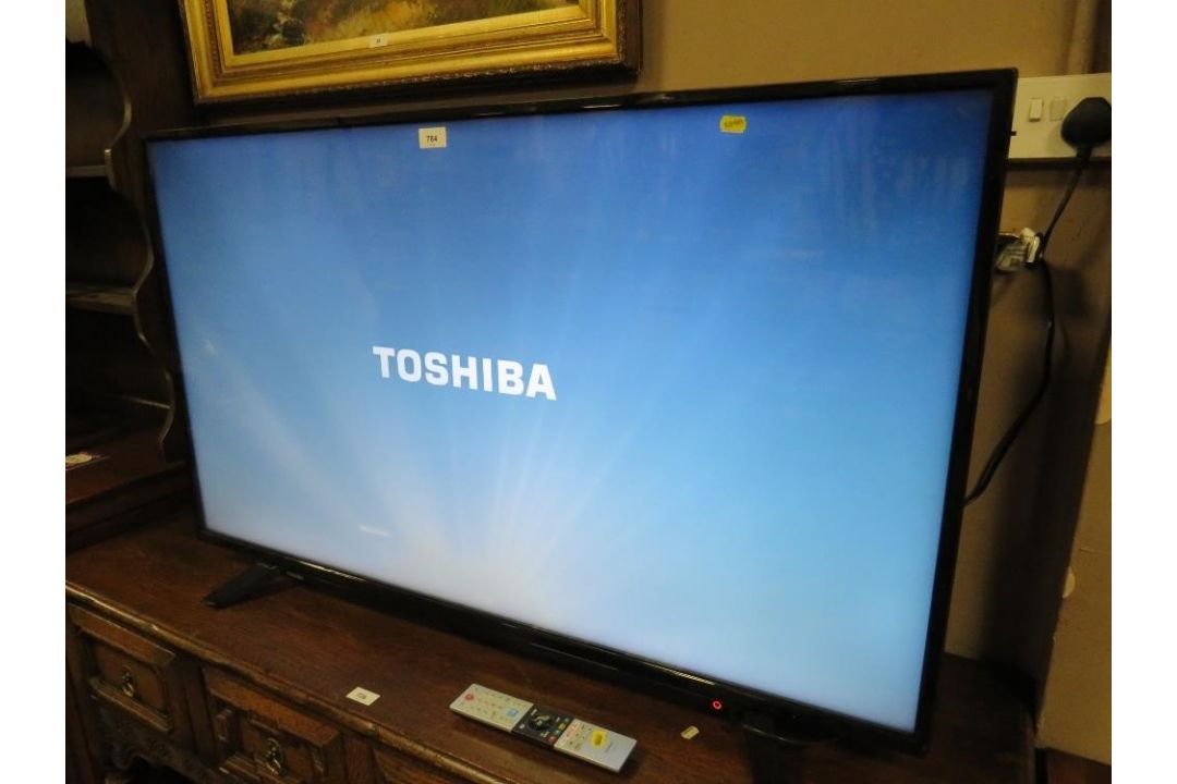A Toshiba 50 inch flatscreen television with remote - Image 2 of 7