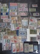 A collection of world bank notes, to include issues from China, Jason Islands, Spain, Greece etc.,