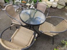 A modern small garden bistro patio set with table and four chairs
