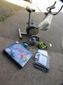 A Carl Lewis exercise bike etc., to incldue dumbells and kettle bells