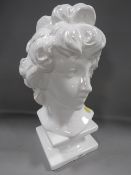 A ceramic bust of a lady