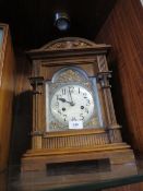 A vintage wooden mantle clock