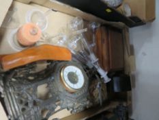 A tray of sundries to include a cast metal mounted clock
