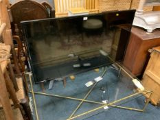 A Toshiba 50 inch flatscreen television with remote