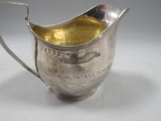 An antique Georgian hallmarked silver cream jug