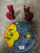 A decorative Poole dish together with a pair of decorative Poole ceramic cats