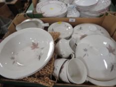 A tray of Royal Doulton Tumbling Leaves tea and dinner ware