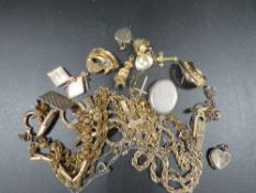 A bag of assorted silver and yellow metal costume jewellery