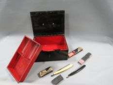 A locked storage box contents unknown together with boxed razors a/f