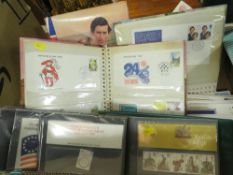 A box of stamp albums and first day covers