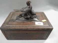 An antique treen cigar box with applied of grouse decoration to lid