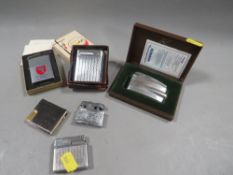 A quantity of vintage cigarette lighters
