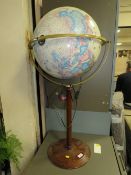 A modern illuminating globe on stand