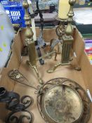 A quantity of metal ware to include candlesticks, fire dogs etc