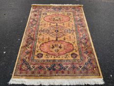 A 20th century woollen rug 175 x 121 cm