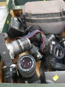 A tray of vintage cameras and accessories to include Canon