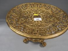 A good quality pierced gilt metal table comport on four ball and claw feet