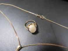 A chain with opal pendant stamped 9k together with an opal ring marking indistinct approx.