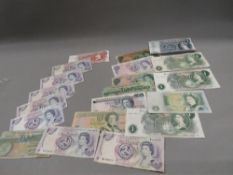 A collection of old Bank of England banknotes to include a Hollom five pounds