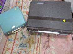 A vintage Smith Corona portable typewriter together with a smaller example