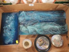 A box containing early Prattware and Majolica style plaques