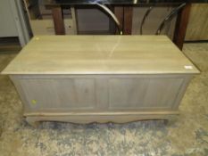 A modern limed blanket box with lift up lid