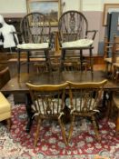An oak refectory dining table with four chairs, and two other wheel back chairs A/F