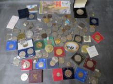 A tin of mainly modern commemorative coins, to include various Commonwealth crowns, a 1994 D-Day