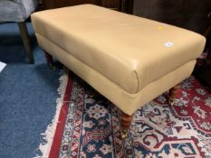 A modern rectangular upholstered stool