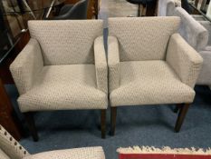 A pair of modern upholstered armchairs