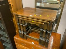 An oak nest of three tables