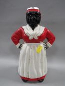 A vintage cast metal figural money bank